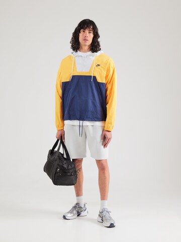 Nike Sportswear Přechodná bunda 'MARINA' – žlutá