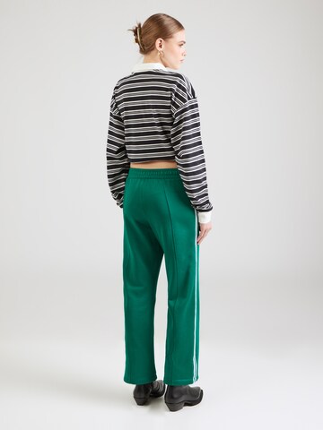 Loosefit Pantaloni di Champion Authentic Athletic Apparel in verde