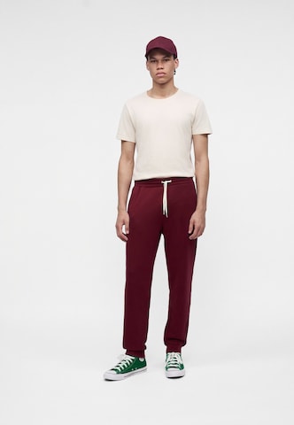 Tapered Pantaloni 'CHUCK' di CONVERSE in rosso