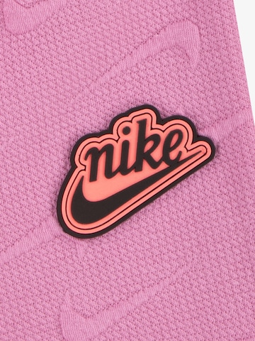 Nike Sportswear Široke hlačnice Hlače 'NEW IMPRESSIONS' | roza barva