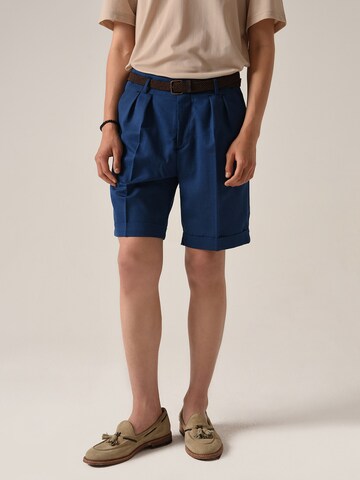 Antioch Loose fit Pleat-front trousers in Blue: front