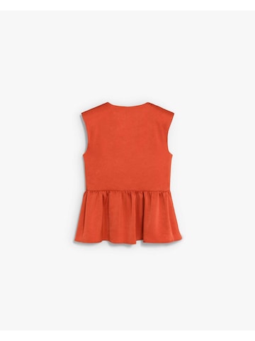 Haut Scalpers en orange : derrière