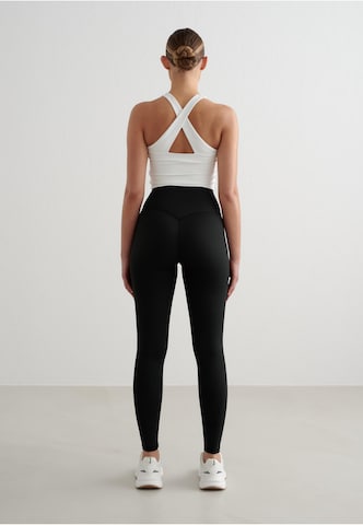 Bustino Reggiseno sportivo 'Essential' di Aim'n in bianco