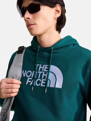 THE NORTH FACE Bluzka sportowa 'THE NORTH FACE M ESS DP REG HODDIE FELPA' w kolorze zielony