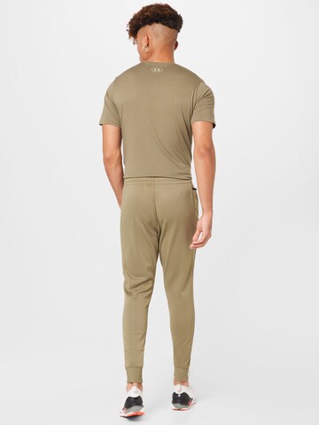 UNDER ARMOUR Tapered Sportbroek in Groen