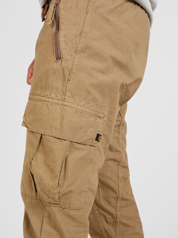ALPHA INDUSTRIES Tapered Cargo trousers in Brown