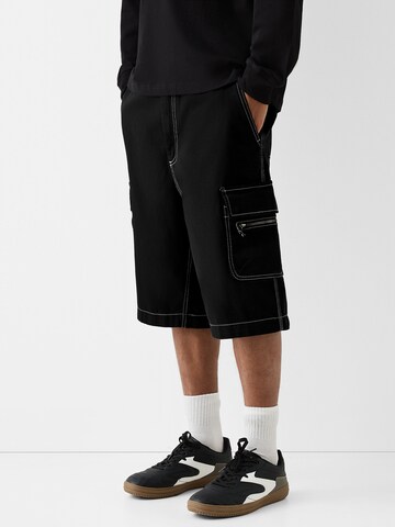 Loosefit Pantalon cargo Bershka en noir : devant