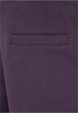Tapered Pantaloni di Urban Classics in lilla