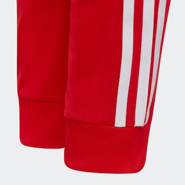 ADIDAS ORIGINALS Pants in Red