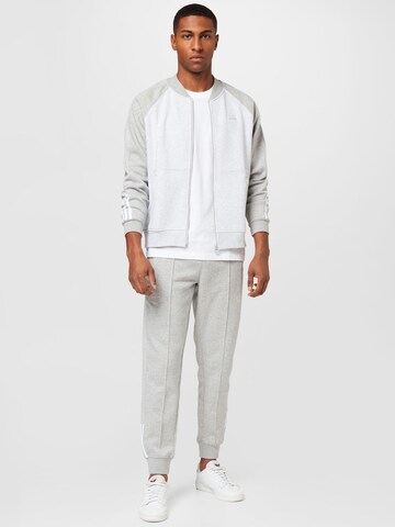 ADIDAS ORIGINALS Tapered Pants 'Fleece Sst' in Grey