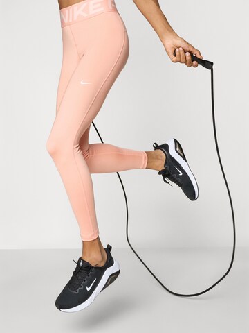 oranžinė NIKE Siauras Sportinės kelnės