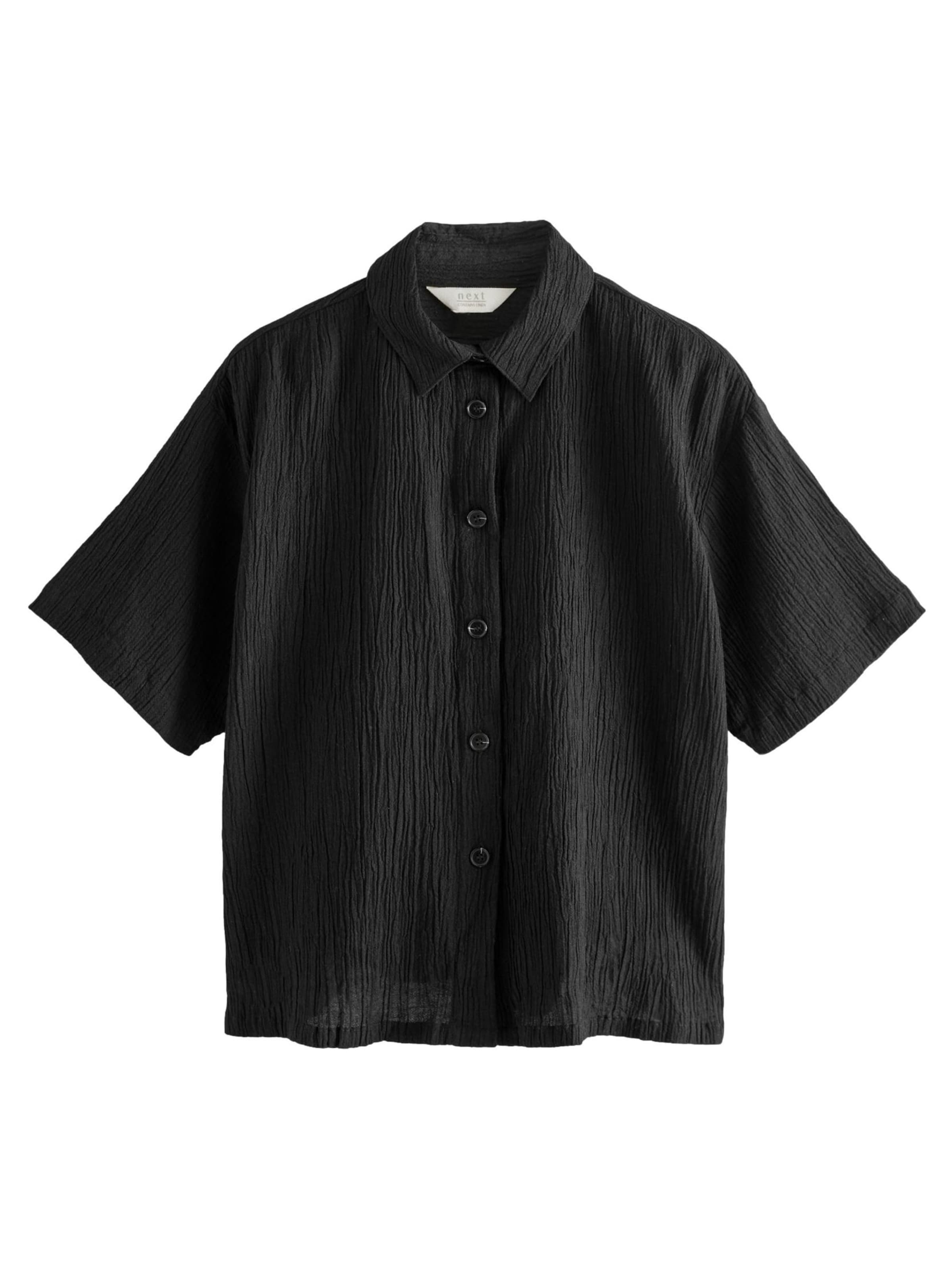 Next Blus i svart: framsida