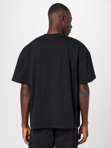 Karl Kani T-shirt 'College Signature Heavy' i svart