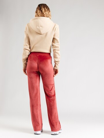 Nike Sportswear Свободный крой Штаны в Оранжевый