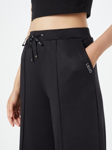 Liu Jo Zvonové kalhoty Kalhoty s puky 'Felpa' – černá