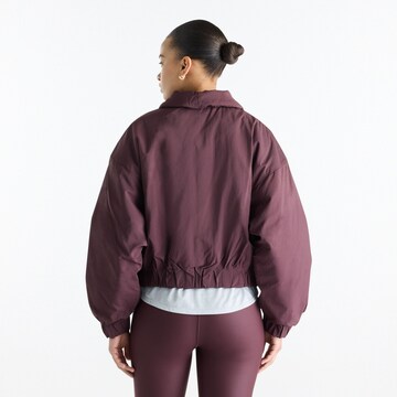 new balance - Chaqueta de entretiempo 'Woven Bomber Jacket' en marrón