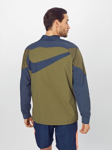 Veste de sport NIKE en bleu