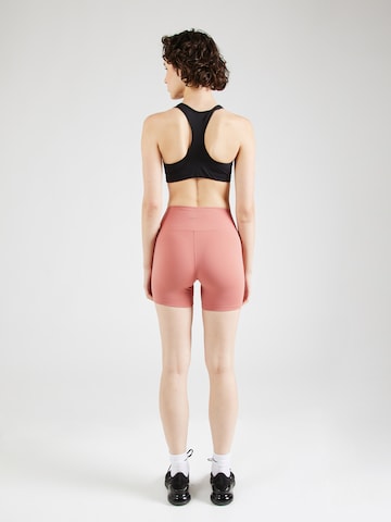 Skinny Pantaloni sportivi 'ONE' di NIKE in rosa