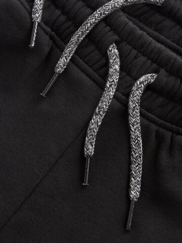 Tapered Pantaloni di Next in nero