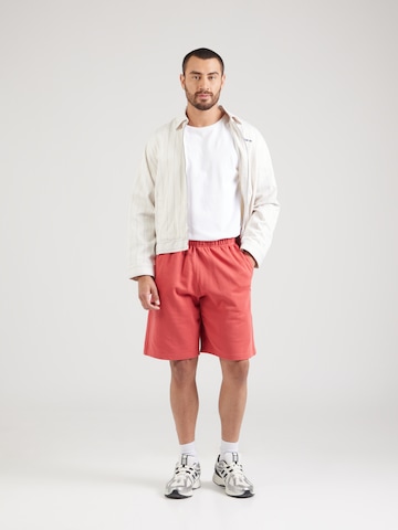 Loosefit Pantaloni di Champion Authentic Athletic Apparel in rosso