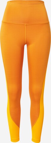 Reebok Skinny Workout Pants in Orange: front