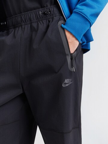 Nike Sportswear Ohlapna forma Funkcionalne hlače 'Tech' | črna barva