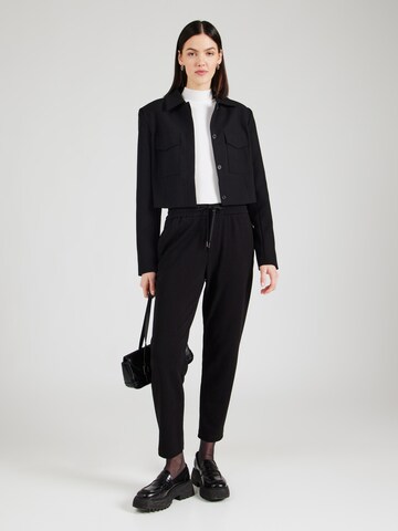 Tapered Pantaloni di s.Oliver in nero