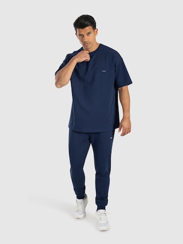 Effilé Pantalon de sport 'Nilo' Smilodox en bleu