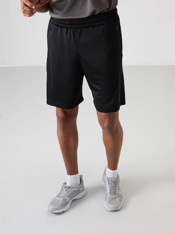 Regular Pantalon de sport Tommy Life en noir : devant