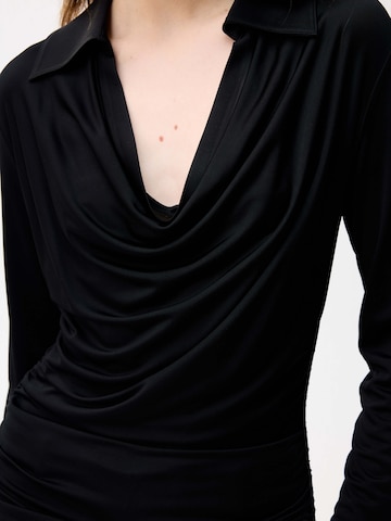 adl Bluse‌‌‌ in Schwarz
