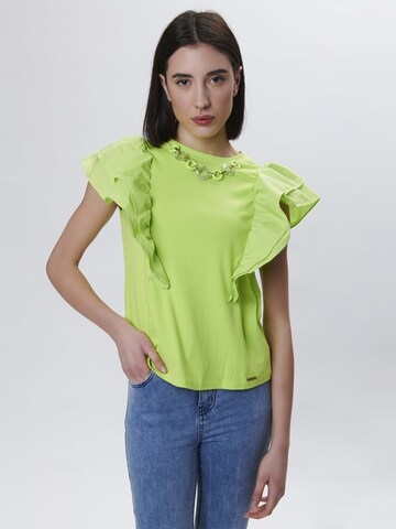 Haut Influencer en vert : devant