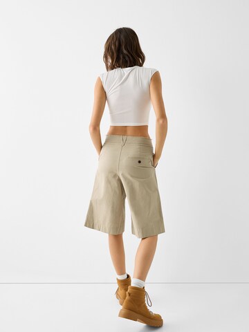 Bershka Wide leg Pleat-front trousers in Beige