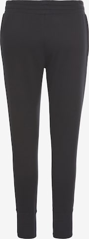 UNDER ARMOUR Tapered Sportbroek 'Rival' in Zwart