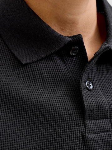 Jack & Jones Junior - Camiseta 'JJEAUSTIN' en negro