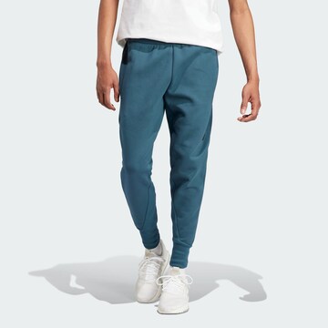 ADIDAS SPORTSWEAR - Tapered Calças de desporto 'Z.N.E. Premium' em azul: frente