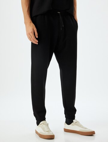 Koton Regular Trousers in Black: front