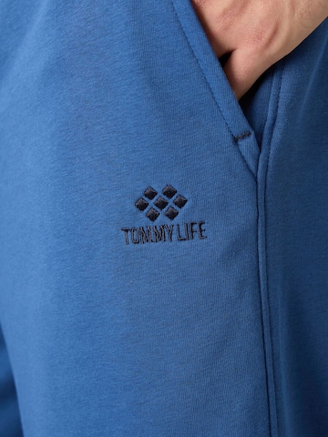 Tommy Life - Perna larga Calças cargo em azul