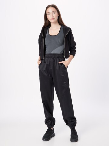 Reebok Ozke Športne hlače 'Tech-Style' | črna barva
