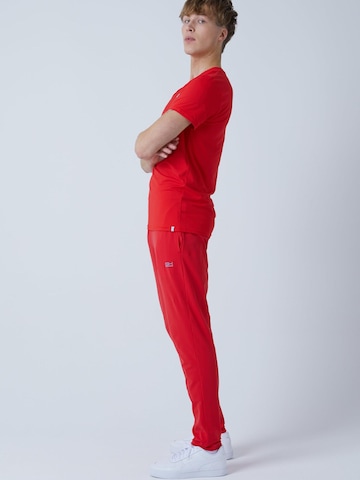 SPORTKIND - Slimfit Pantalón deportivo 'Slim Training Pants' en rojo