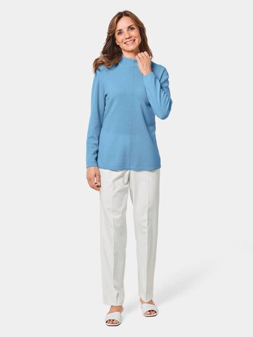 Goldner Pullover in Blau