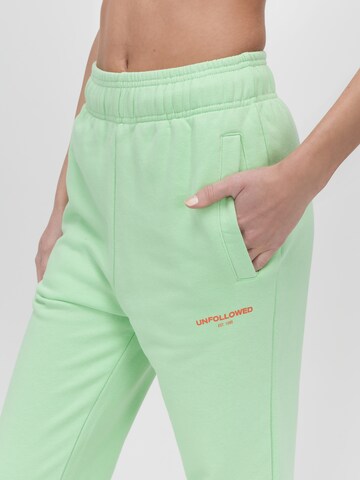 UNFOLLOWED x ABOUT YOU Tapered Pants 'HUNGRY' in Green