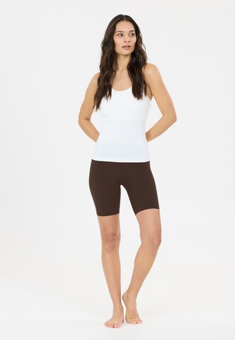 Athlecia Skinny Sportbroek 'Emarri' in Bruin