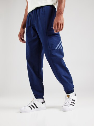 Tapered Pantaloni di ADIDAS ORIGINALS in blu: frontale