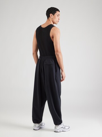 Nike Sportswear Loose fit Trousers 'CLUB OS' in Black