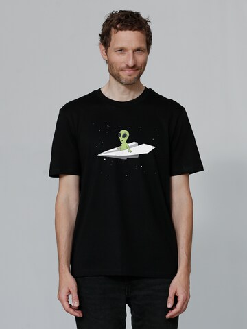 T-Shirt 'Alien on a paper plane' Watapparel en noir : devant