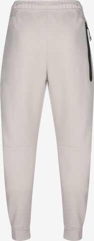 Nike Sportswear Tapered Broek in Beige