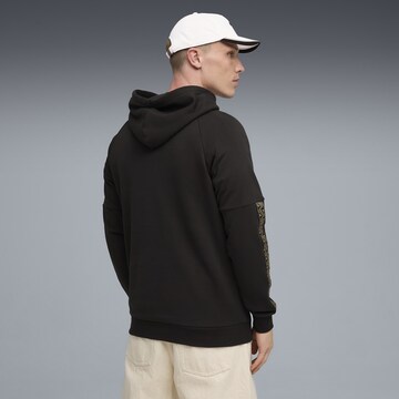 PUMA Sportsweatshirt 'King' in Schwarz