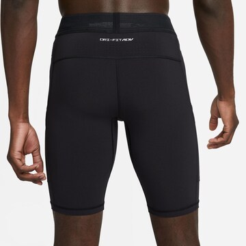 NIKE Skinny Sportbroek 'A.P.S.' in Zwart