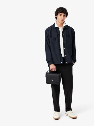 LACOSTE - Mala de ombro 'Lacoste Petit sac messenger Homme Langon Petit Piqué Noir' em preto