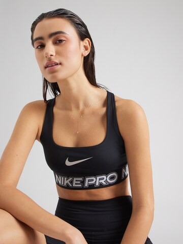 NIKE Μπουστάκι Αθλητικό σουτιέν σε μαύρο: μπροστά